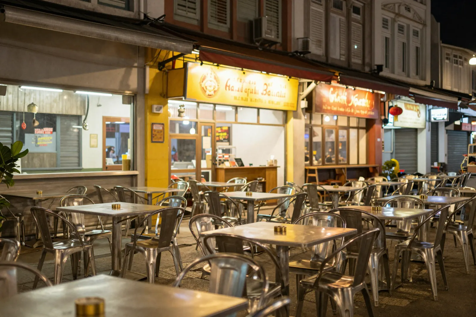 North Bridge Road at night, a row of restaurants with bright signboards